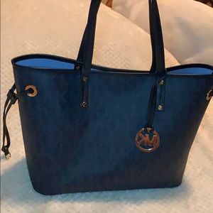 Blue monogrammed Micheal Kors tote